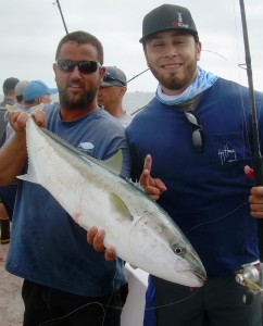 Deckhand Mikie and a passenger's yellowtal